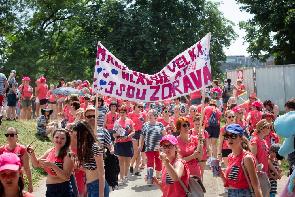 Women marching at the AVON The Walks for breast cancer awareness | Motif