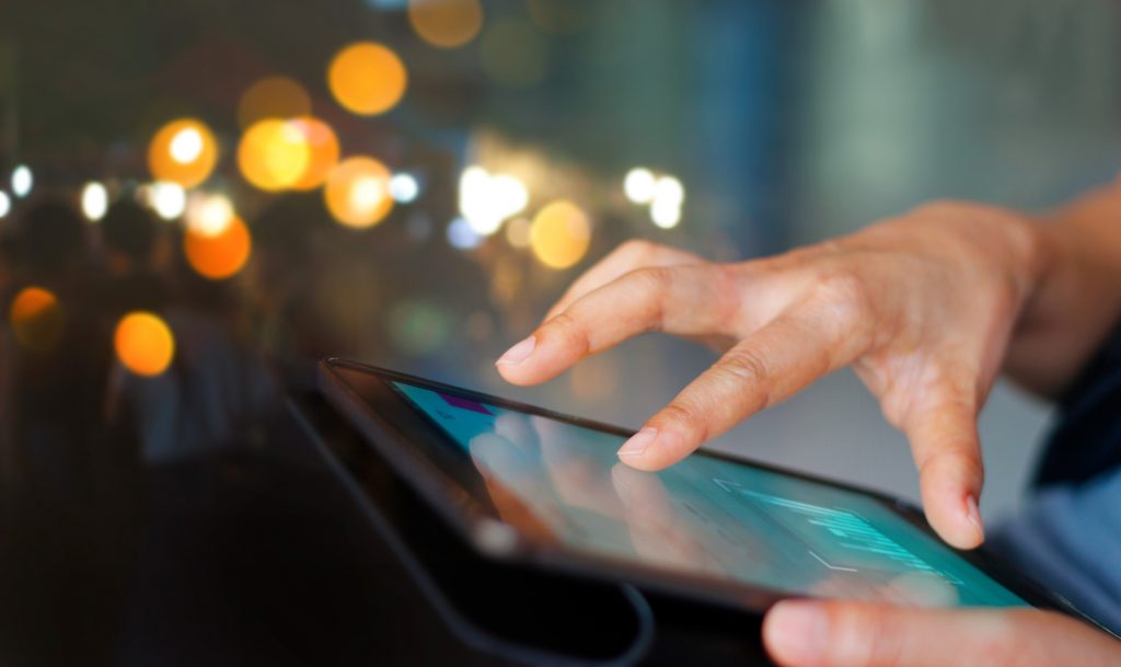 Businessman using tablet at night time